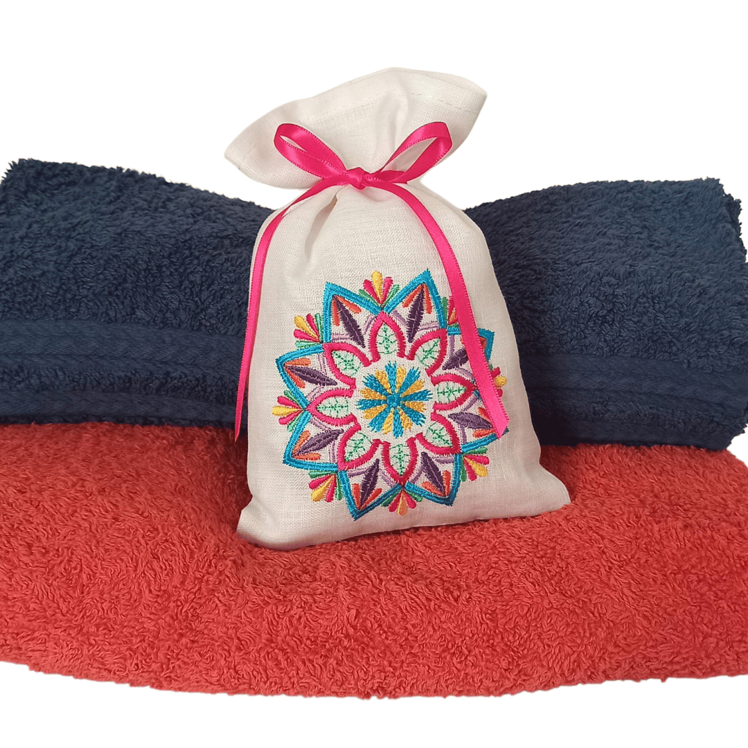 Linen Fragrance Sachet Mandala on top of two terry towels, as a form of example of how to use.